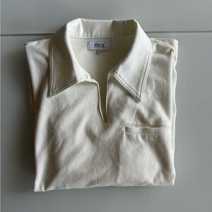 Men’s short sleeve polo in cream with flared collar, size large